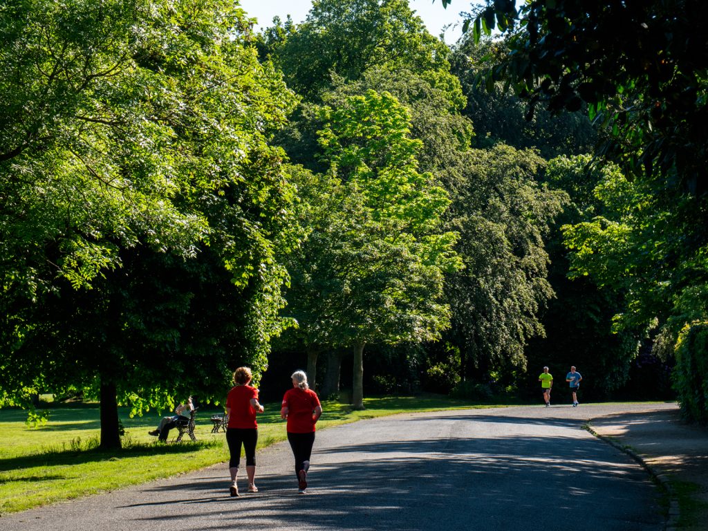 Birkenhead Park - walkers enjoy a long stroll. 