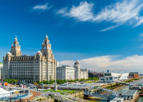 Liverpool city skyline, waterfront and the three graces (The Royal Liver, the Cunard and the Port of Liverpool Buildings) on the River Mersey in North West England, UK.
