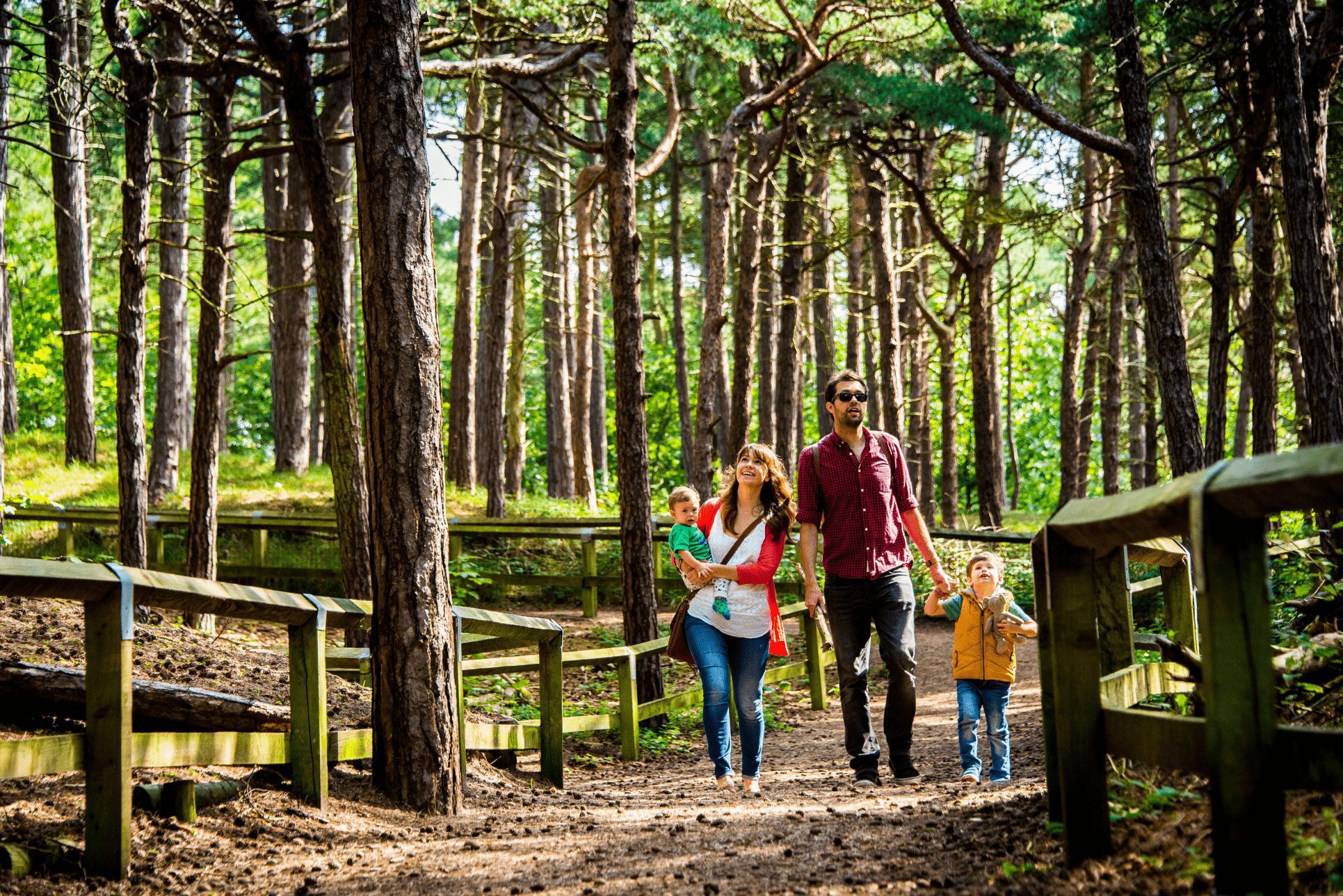 A family walking through woodland