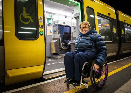 Baroness Tanni Grey-Thompson DBE DL boarding one of the new Liverpool trains.